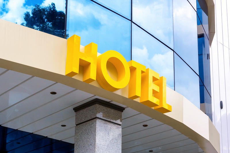 Hotel sign over entrance Hotel sign over entrance